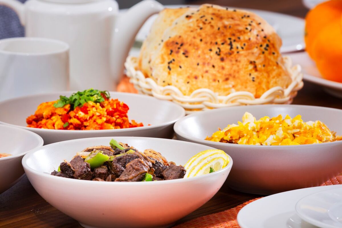 hero-about Delicious assortment of colorful dishes in bowls with bread, perfect for a food-centered stock photo.